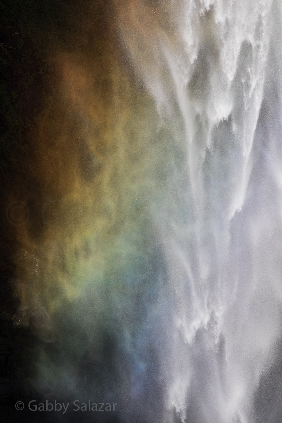 A rainbow spreads across the Chamaral Waterfall in Black River, Mauritius. 